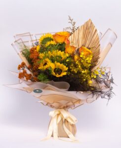 Sunset Breeze – Love calm like breeze and mesmerizing like sunset deserves a bouquet of fresh sunflowers, roses and orchids