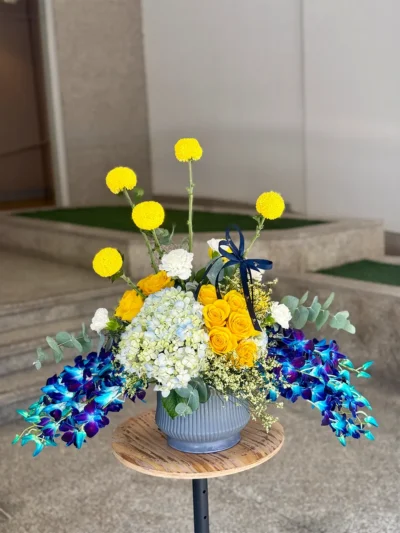Spring flower vase with roses orchids hydrangea arrangement